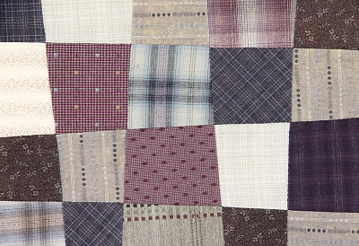 Patchwork quilt made by a sewing machine.