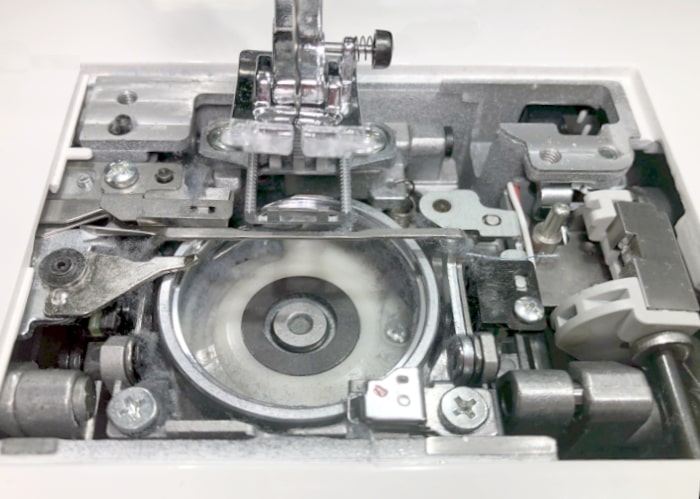 Janome Bobbin Case Area with Dust and Fluff Buildup